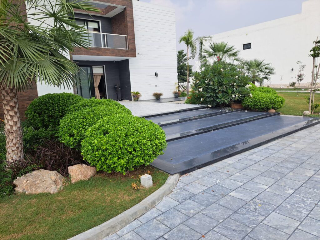 "Sleek hardscape and soft landscape blend in Contemporary garden – residential landscape installation"