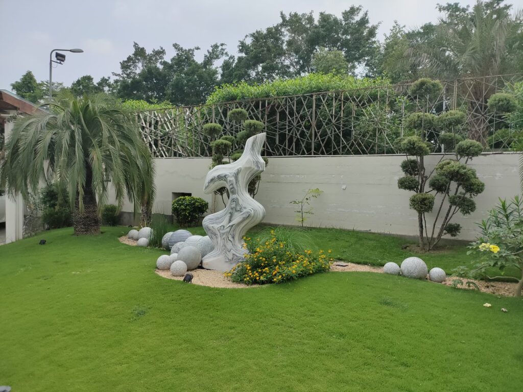 "Professionally executed softscape and hardscape design at US Apparel House – Residential landscape project"