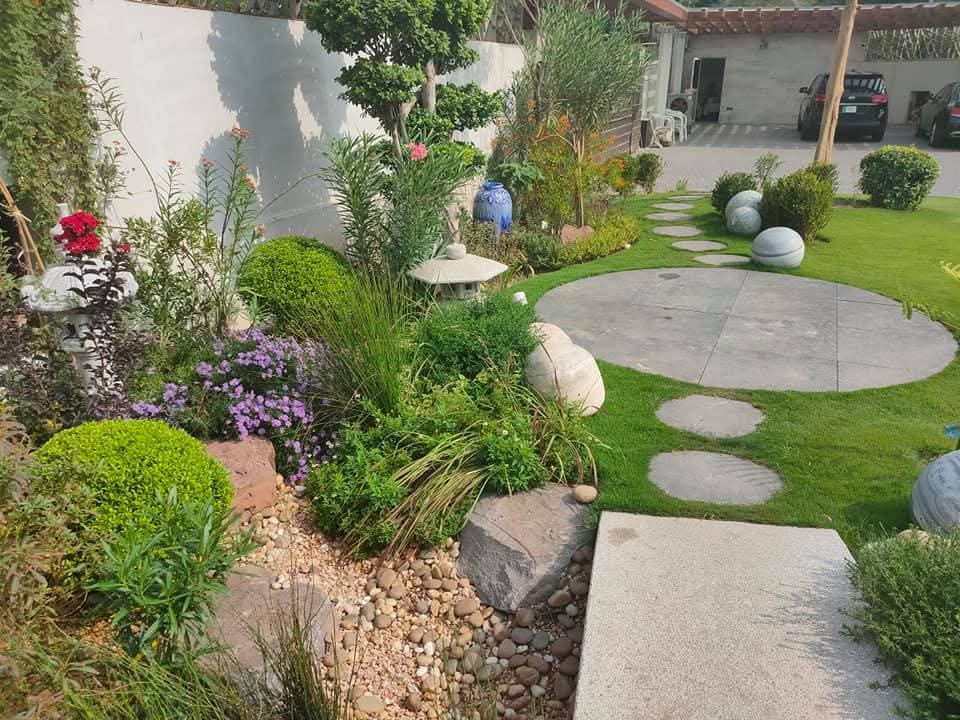 "Professionally executed softscape and hardscape design at US Apparel House – Residential landscape project"