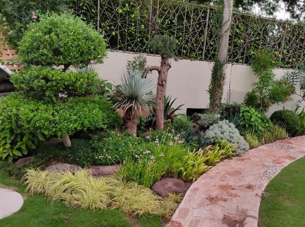 "Functional and aesthetic landscape execution at US Apparel House – Project by LandscapeCompany.pk"