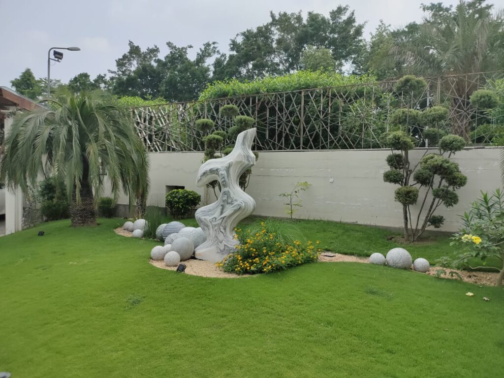 "Functional and aesthetic landscape execution at US Apparel House – Project by LandscapeCompany.pk"