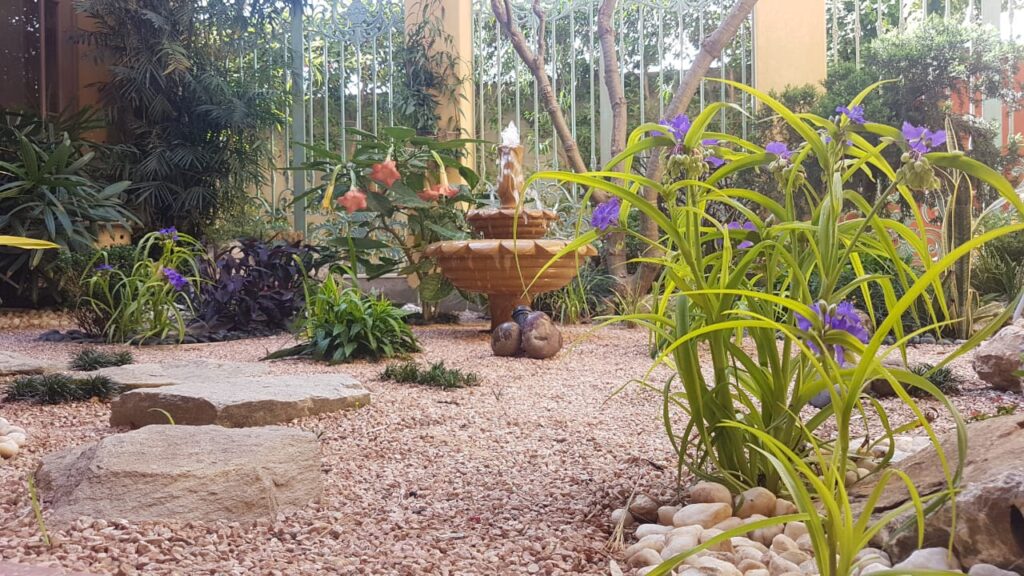 "Mediterranean garden landscape with rustic stonework and drought-tolerant plants – Landscape execution project"