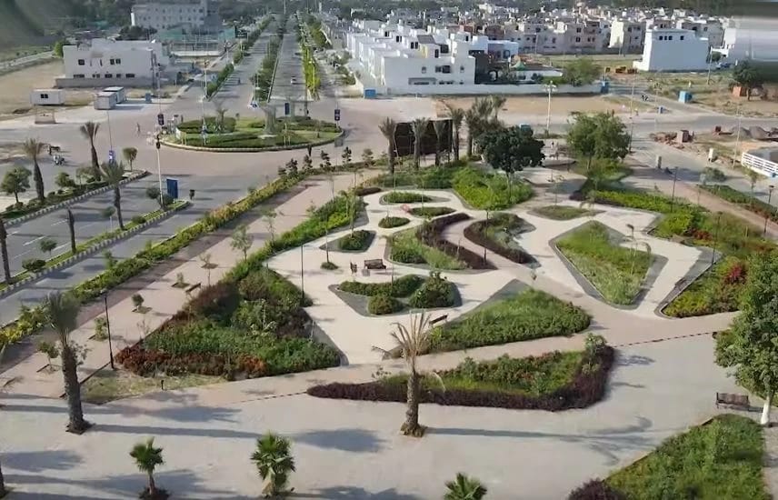 Finished commercial landscape execution in Dream Gardens Lahore with trimmed hedges and native plants